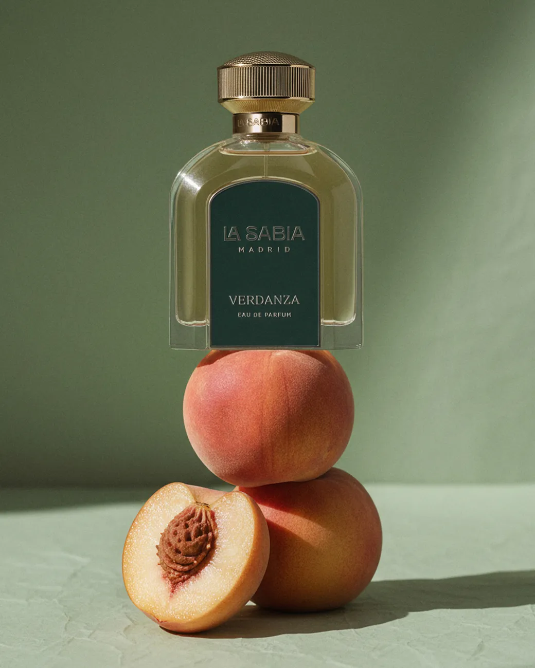 A green fragrance stacked on halved peaches · TimeLäB Studio