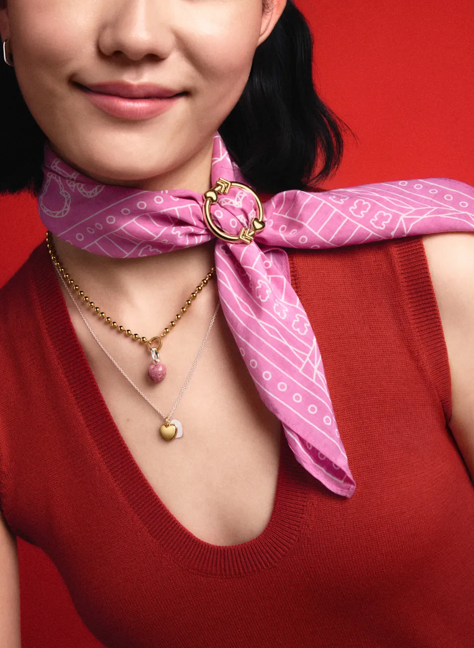A model in red with a pink silk scarf and gold pendant · Fashion retouching, TimeLäB Studio Barcelona