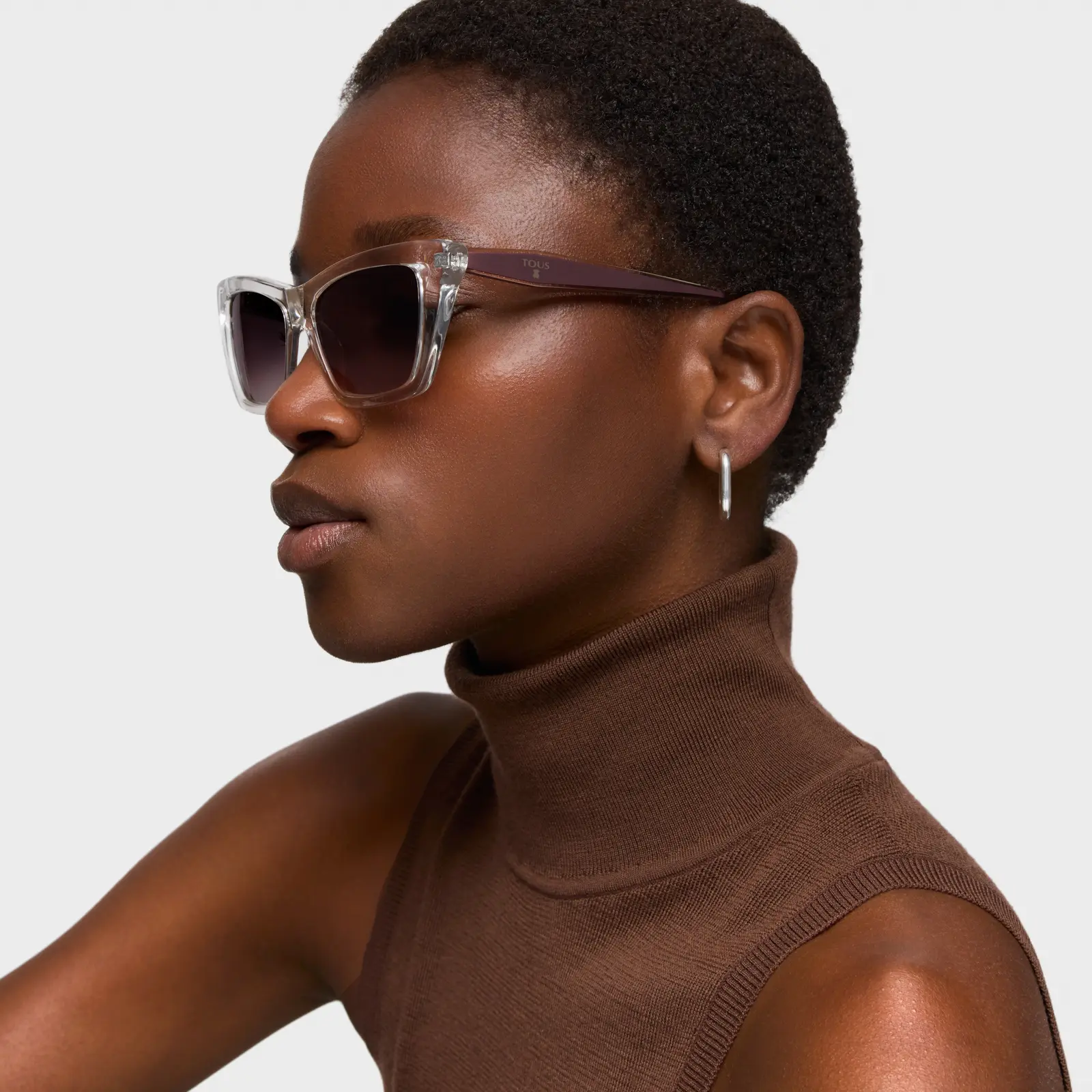 A model in a brown turtleneck and clear-framed sunglasses · Fashion retouching, TimeLäB Studio Barcelona