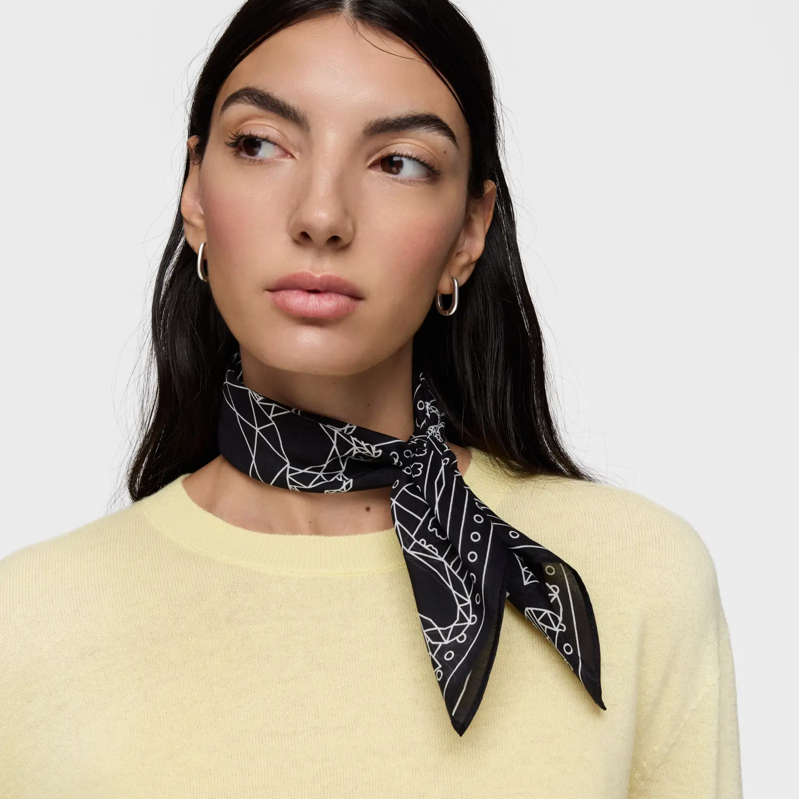 A model in a yellow sweater with a printed silk scarf · Fashion retouching, TimeLäB Studio Barcelona