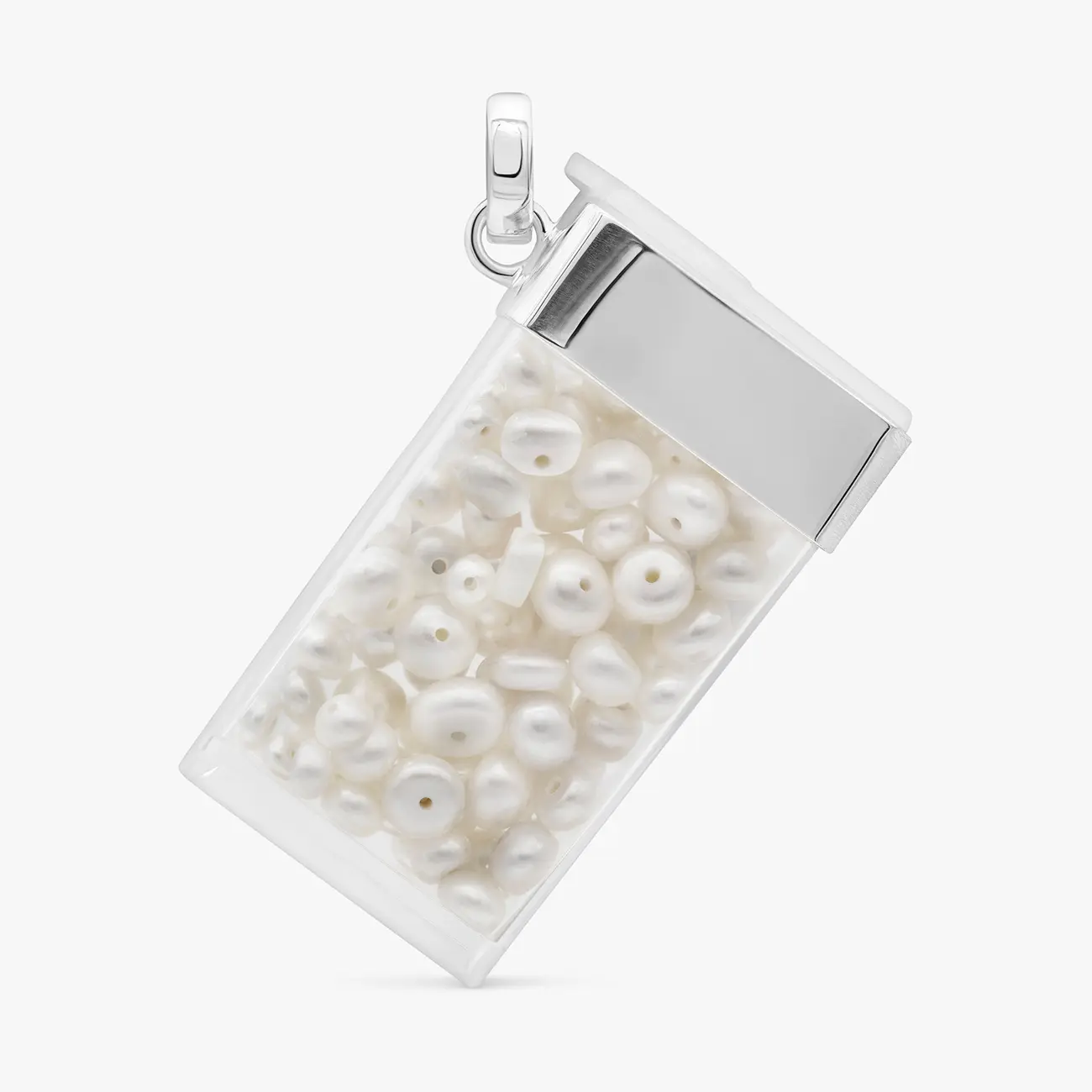 A clear silver-capped pendant filled with freshwater pearls · Jewellery photography, TimeLäB Studio Barcelona