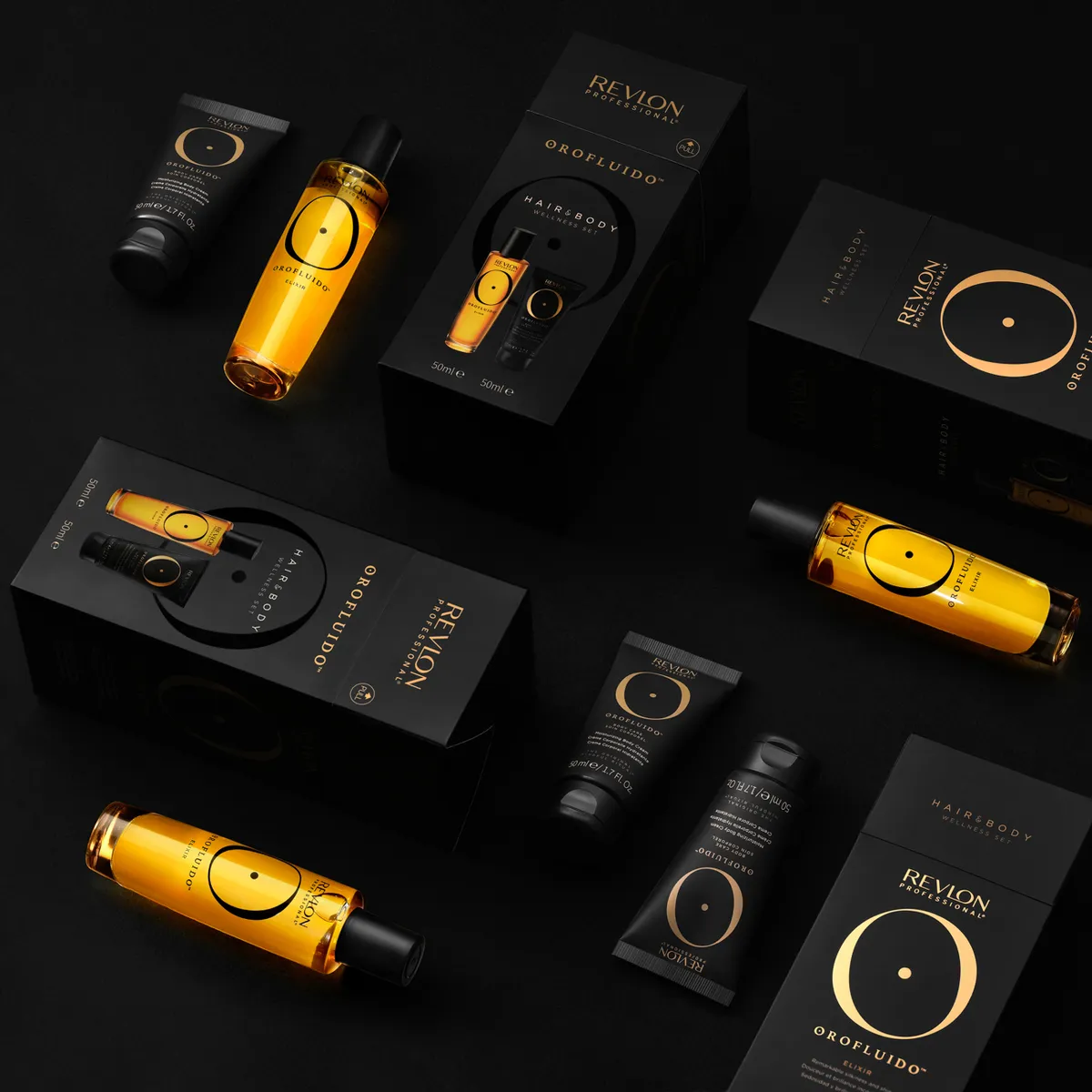 A gold hair-care range arranged on black · Product photography, TimeLäB Studio Barcelona