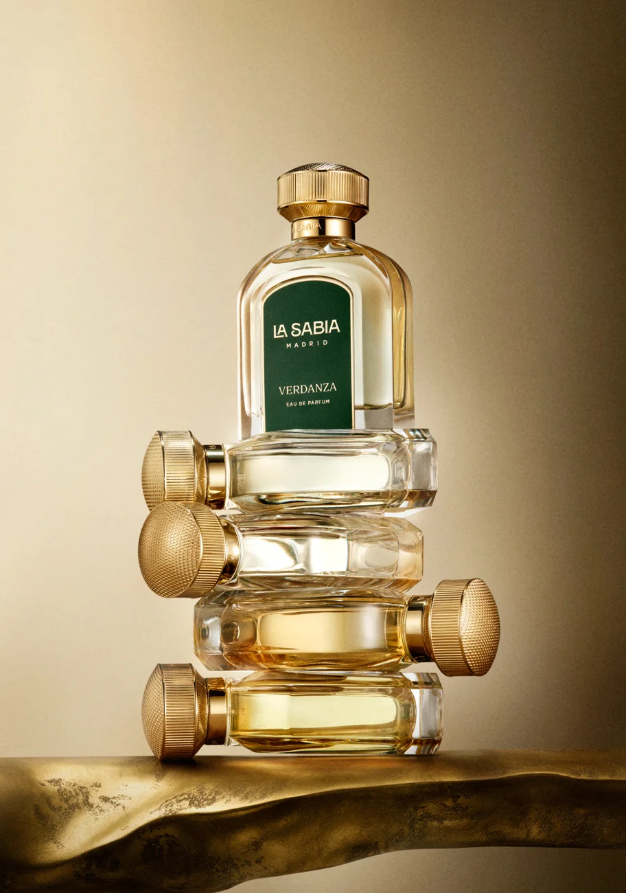 LA SABIA fragrance bottles balanced on a golden surface · Product photography, TimeLäB Studio Barcelona