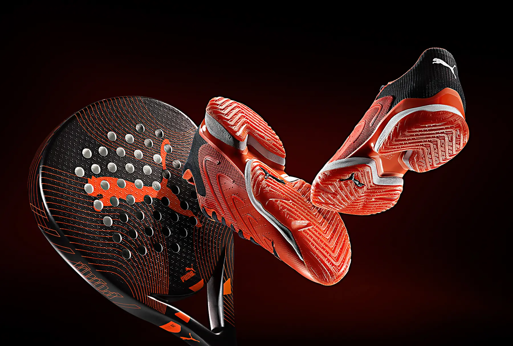 A padel racket and trainers suspended against black · Product photography, TimeLäB Studio Barcelona