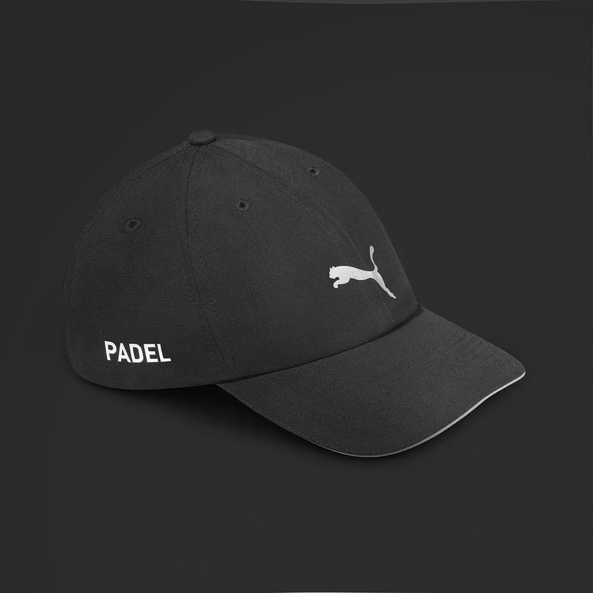 Black PUMA padel cap on a dark background · Product photography, TimeLäB Studio Barcelona