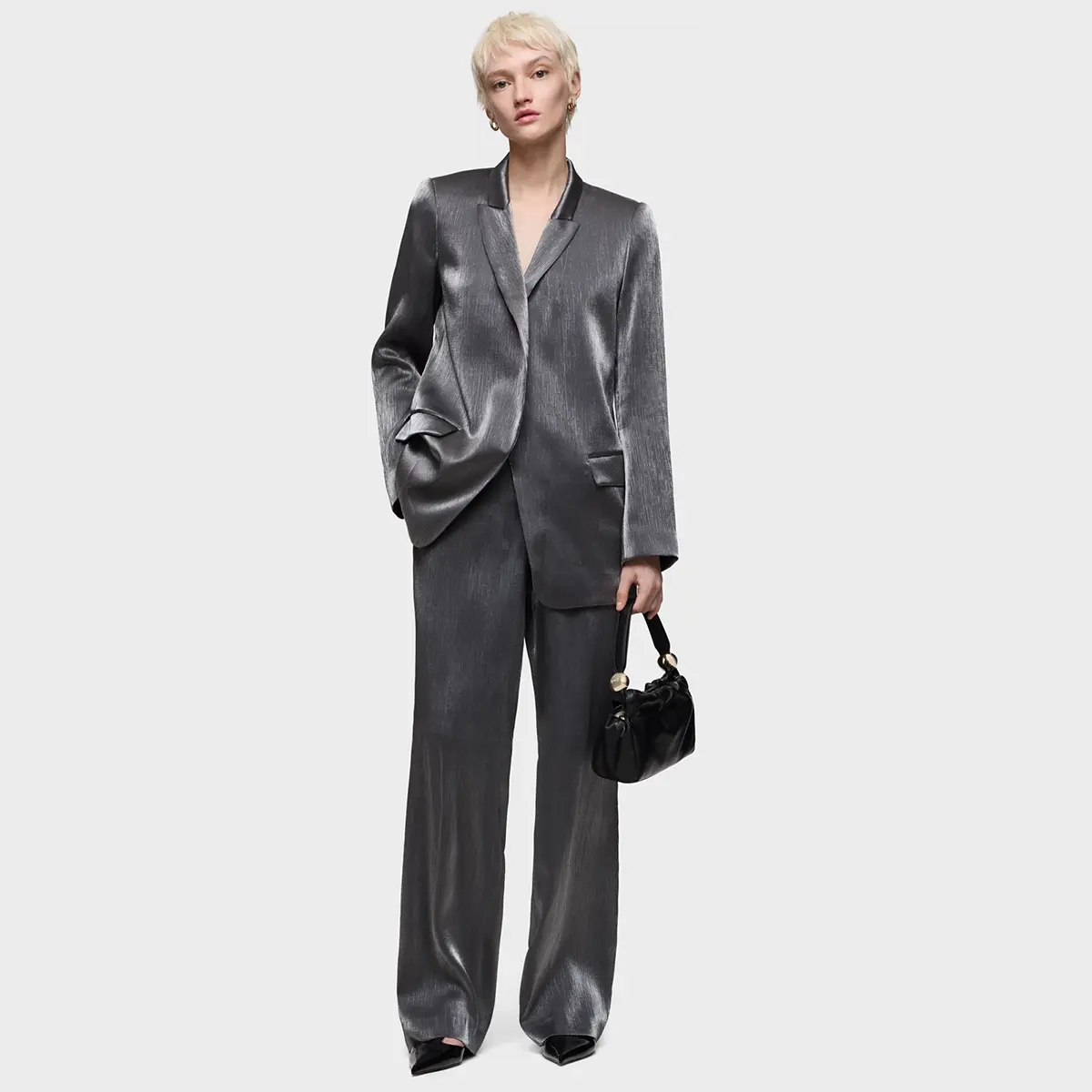 Model in a grey suit, full length on white · Photo retouching, TimeLäB Studio Barcelona